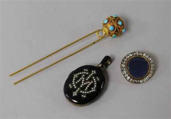 A late 19th century black onyx? and seed pear locket, a brooch and turquoise set hair pin.